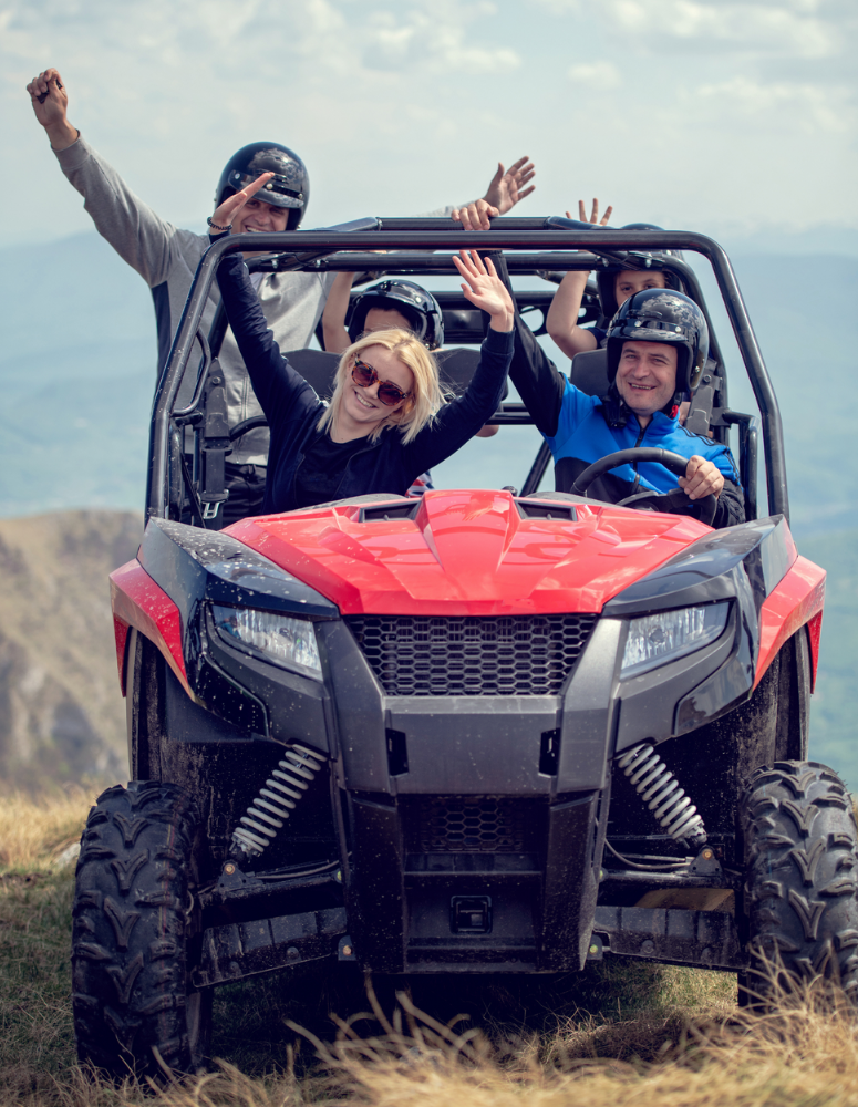 Family riding ATV